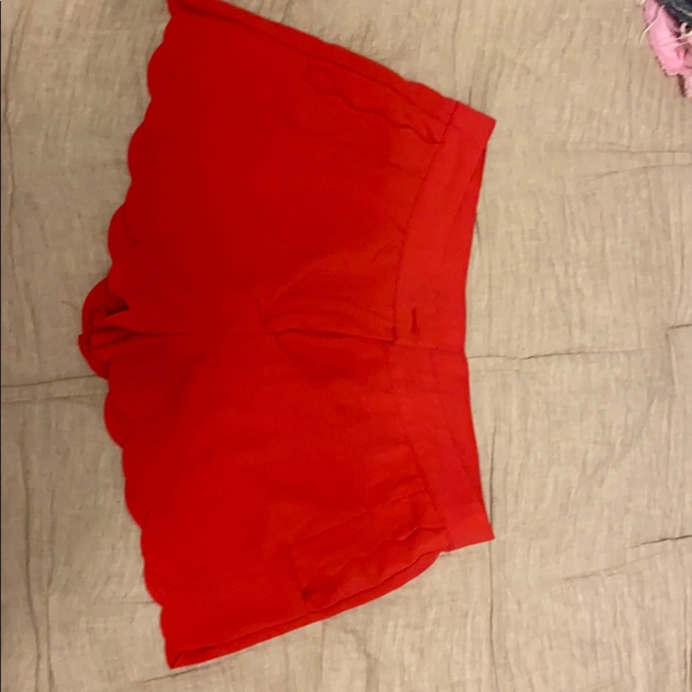 Red scalloped dress shorts.